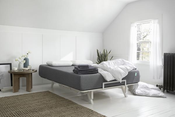 Tuft & Needle products featuring the Mint Mattress, Adjustable Frame, Percale Sheets, Original Foam Pillow, and Down Duvet. Photo courtesy of Tuft & Needle. 