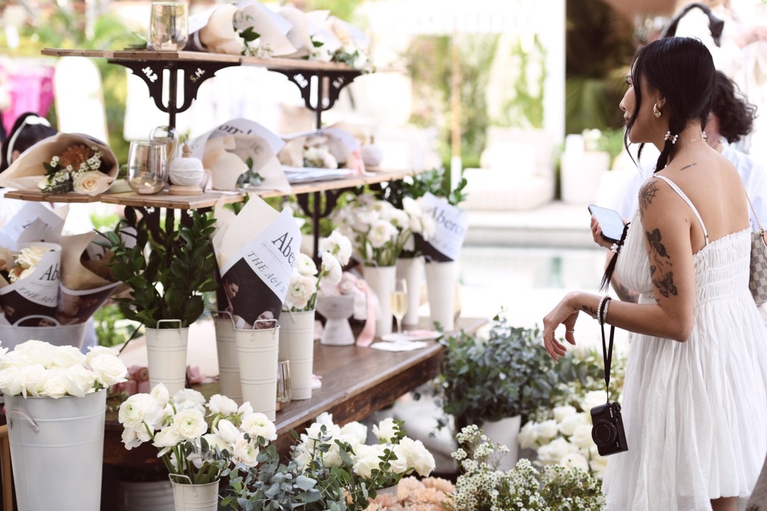 A Pinterest wedding trend, guests were enamored with the “build your own bouquet” flower cart. Photo Credit: Aleks Zagozda
