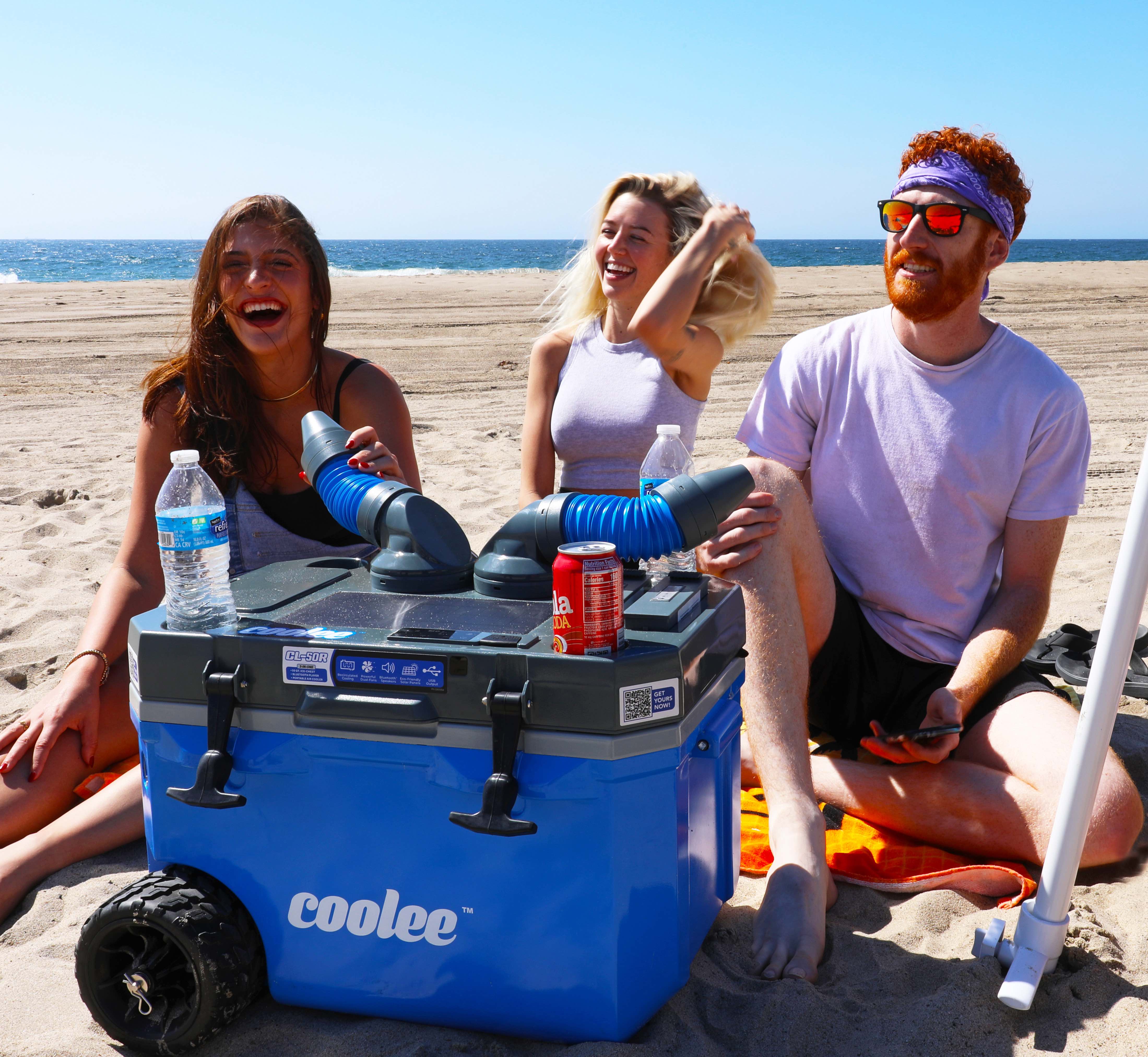 People at the beach enjoying cool breezes and beverages from a Coolee CLR50