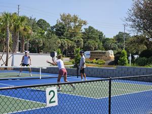 Players enjoy court time on the new hard-surface pickleball courts added at Hidden Dunes Beach & Tennis Resort in Northwest Florida