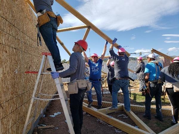 Several employees at Blue FCU work hard and have fun while doing good and helping Habitat for Humanity.