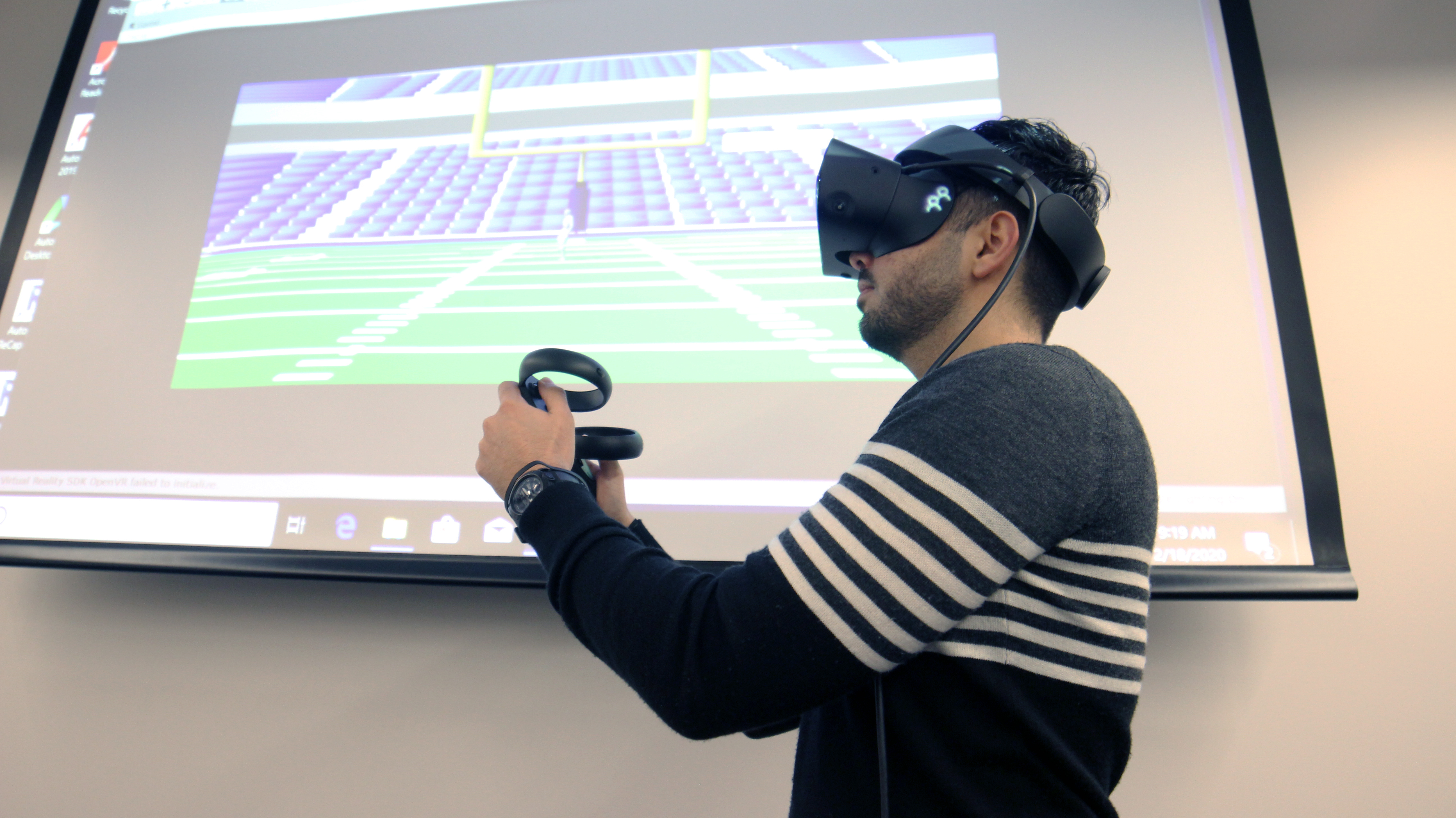 Milad Khanlou, LSU graduate student, demonstrates in front of an early build of the project.