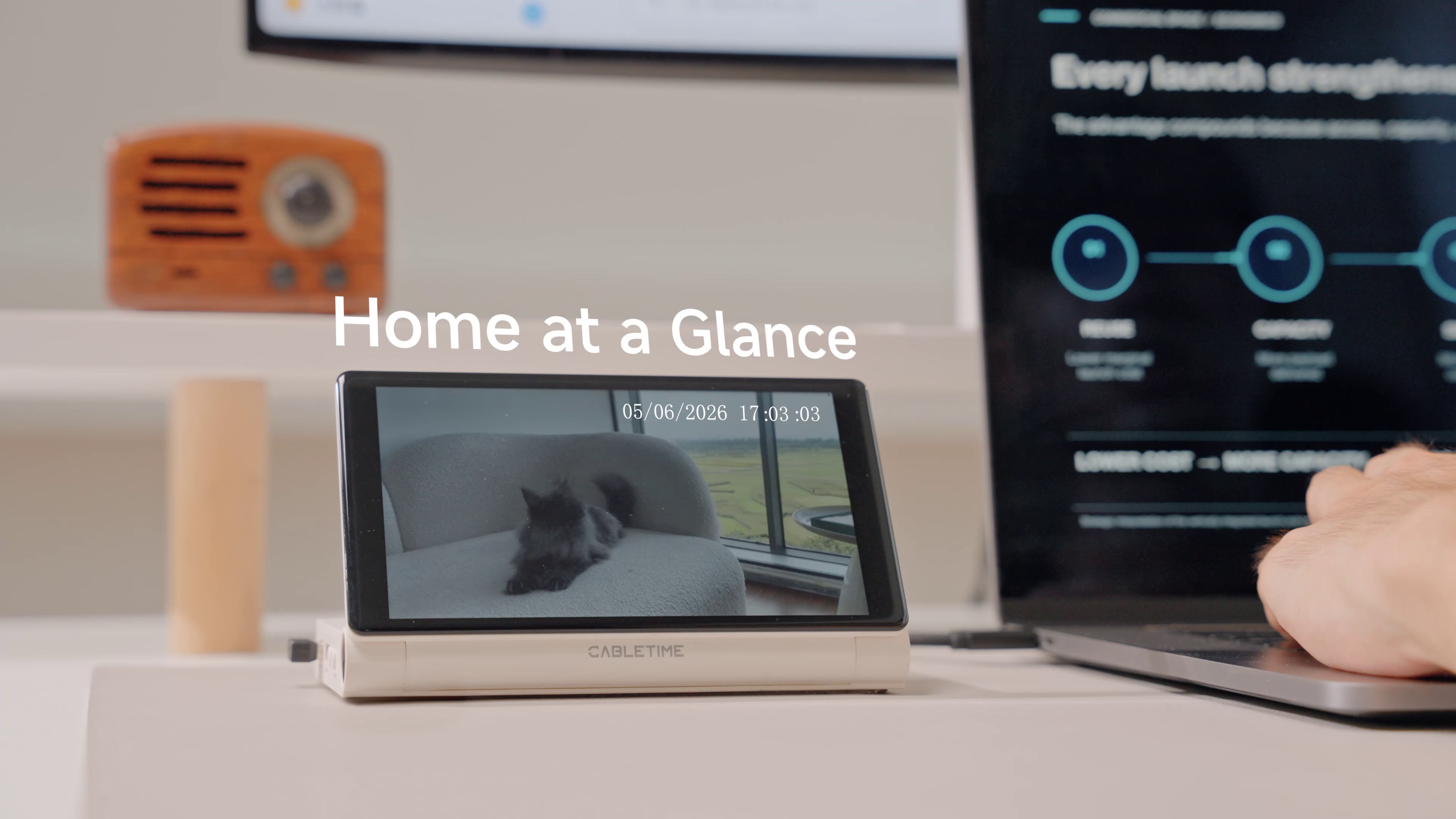 CABLETIME ScreenDock displaying home monitoring beside laptop workspace setup
