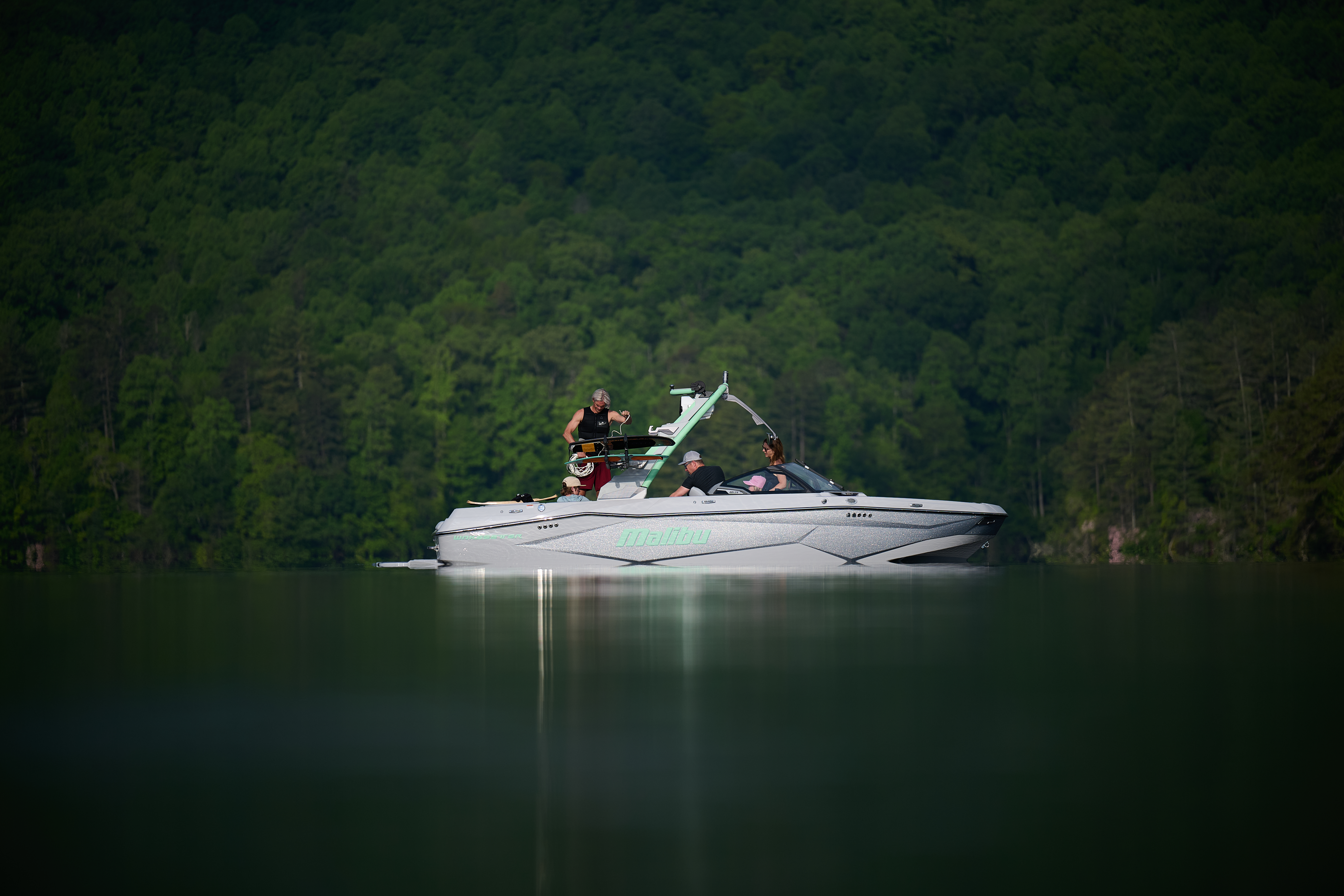 The sleek new look of the 2026 Malibu Wakesetter 22 LSV shines while riders prepare to surf.