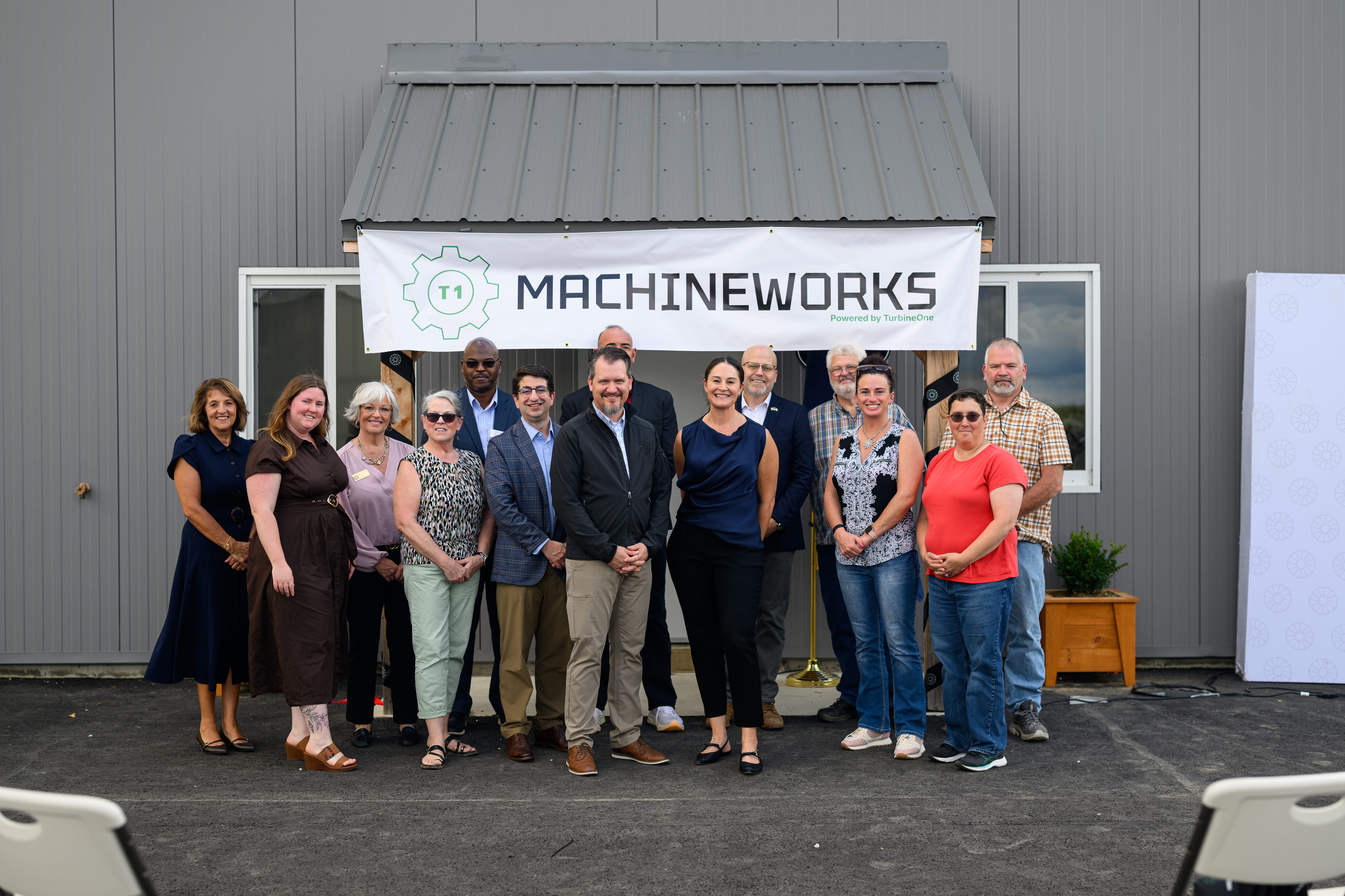 TurbineOne team members and guests gather during the opening of T1 MachineWorks in Old Town, Maine, on Aug. 27, 2026.