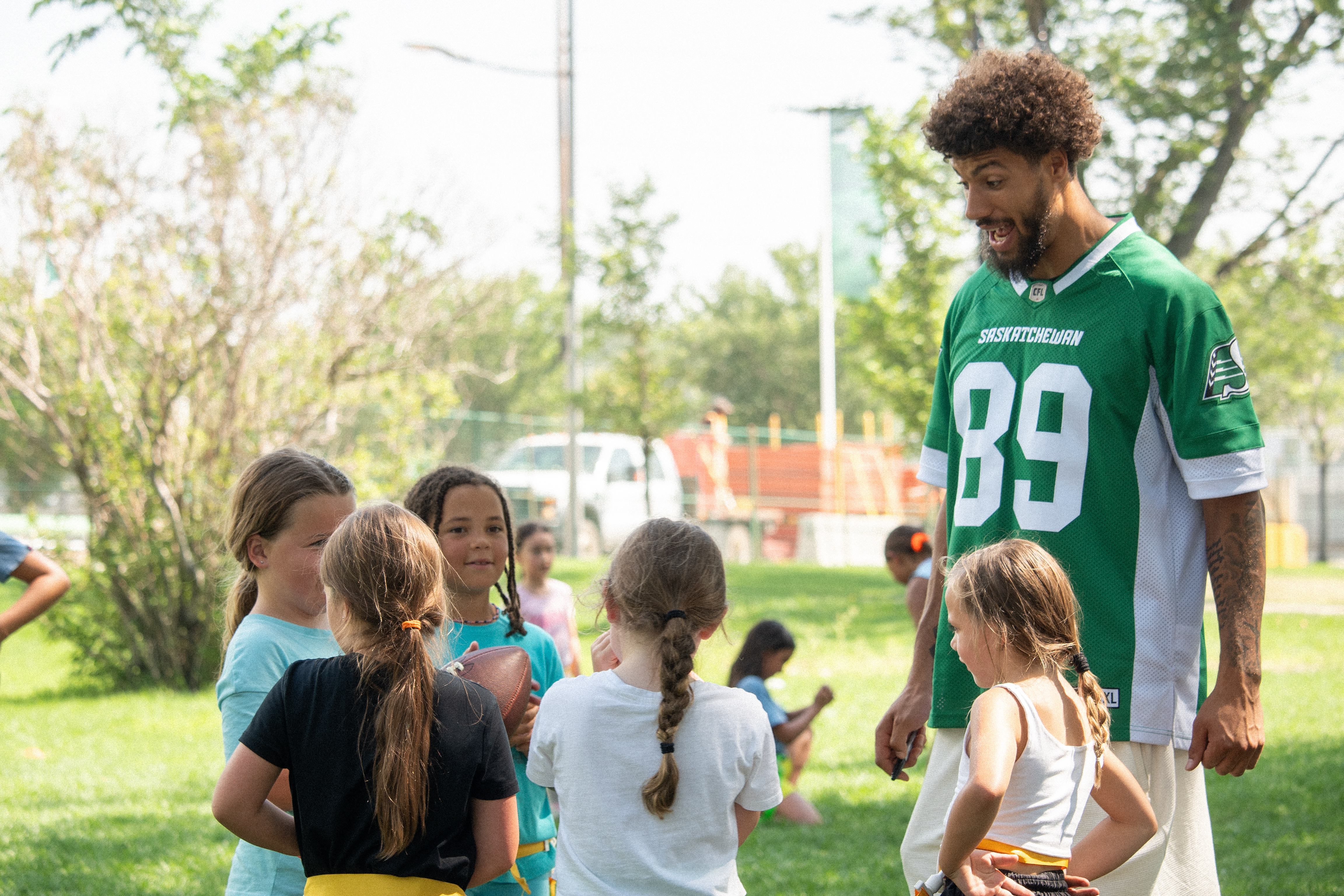 2. Kian Schaffer-Baker of Saskatchewan Roughriders with Young Fans