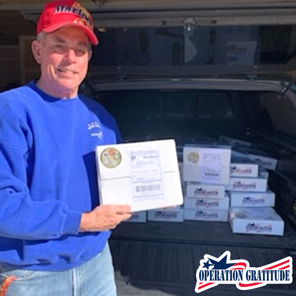 Colonel Michael Lowe, USMC (Ret) distributes 115 Operation Gratitude care packages in partnership with Rocky Mountain Honor Flight in Denver.
