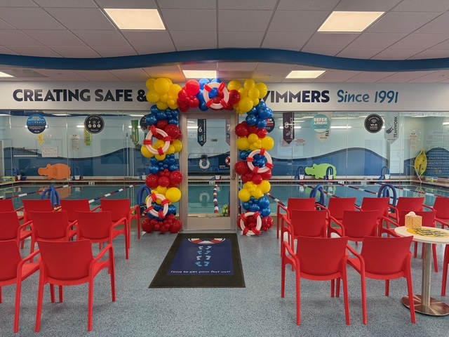 This brand-new, state-of-the-art swim school features 17 swim zones, a glass-paneled, floor-to-ceiling viewing area and front row seats to your child's swim lessons in the signature red Aqua-Tots chairs.