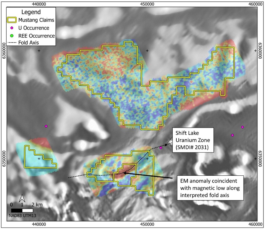 Ford Lake project claims and mineral occurrences over a mosaic VTEM EM decay colour image from 3 separate airborne EM surveys where hot colours indicate electrical conductors, all overlying greyscale magnetic derivative background image. An EM conductor of interest is coincident with a magnetic-low anomaly and located along an interpreted fold axis from a known U occurrence. (map layers retrieved from: Government of Saskatchewan Mining and Petroleum GeoAtlas and Natural Resources Canada) 