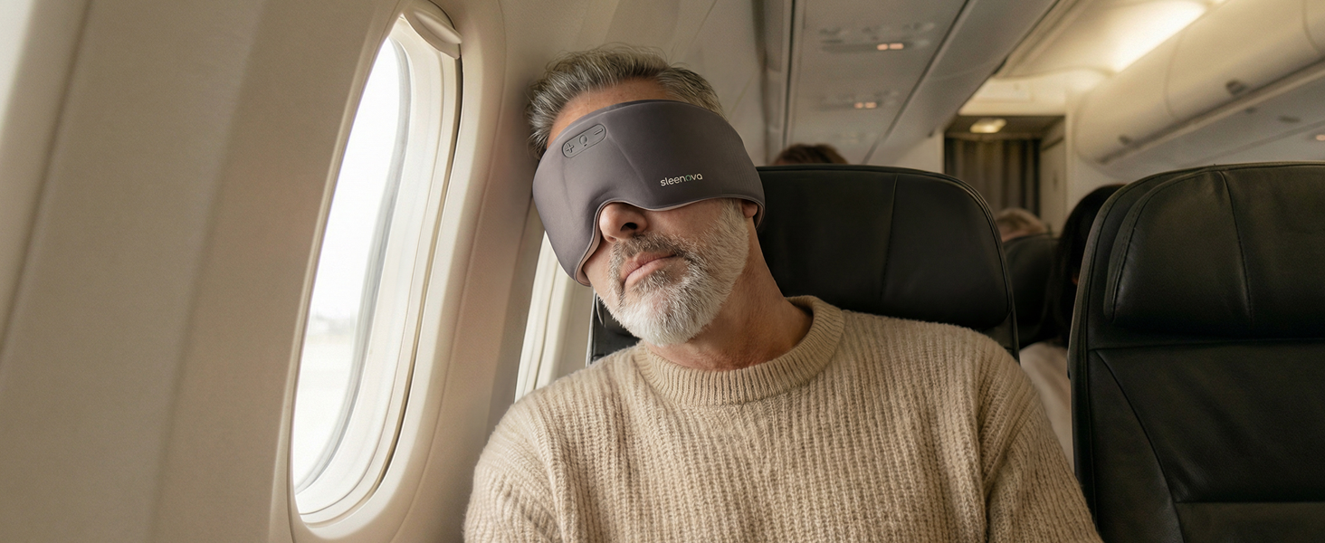Sleenova Soundmask used by a traveler napping on a plane, showing comfortable, distraction-free sleep for remote workers, commuters, and travelers.