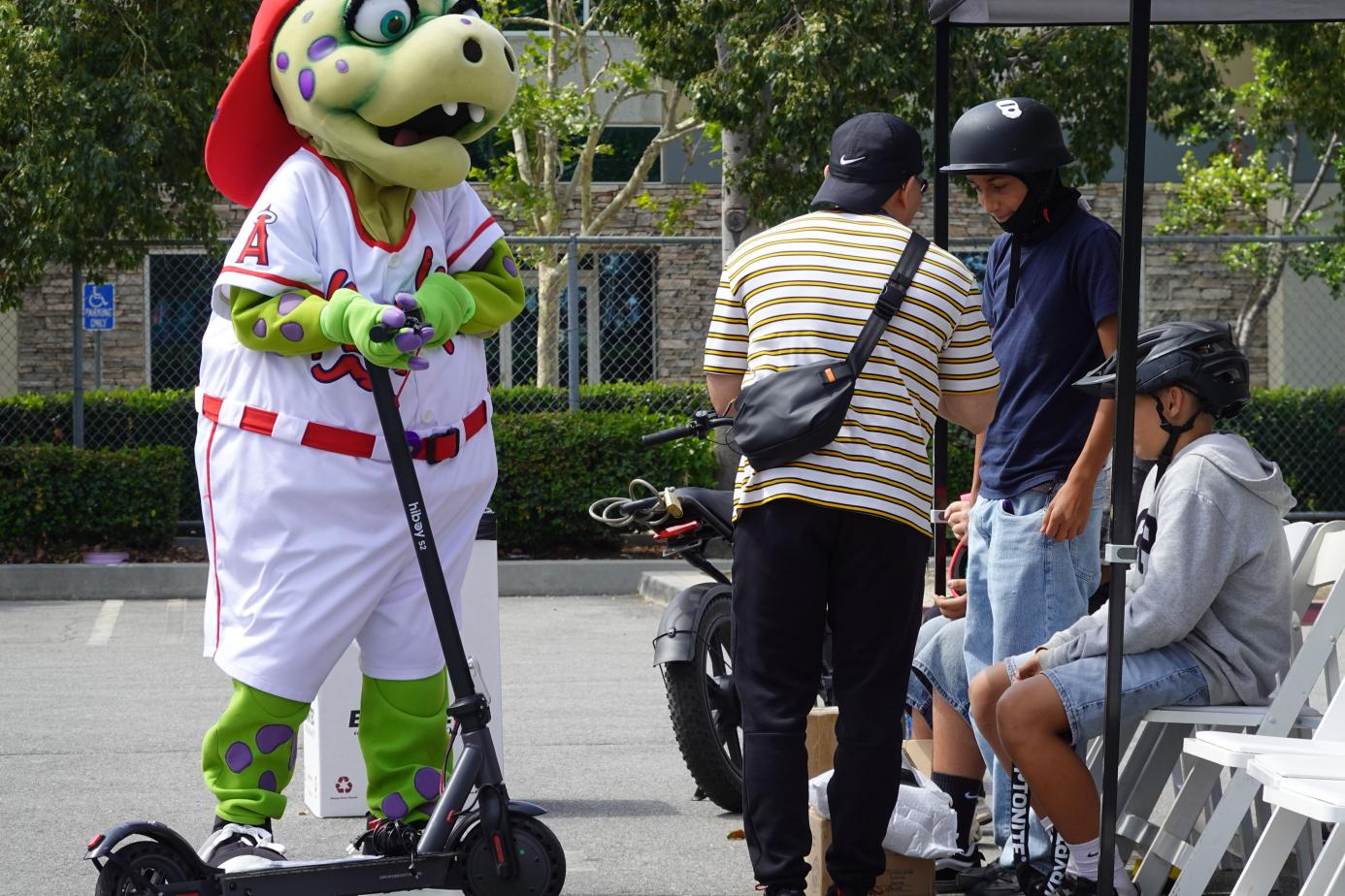 Participants practice safe riding skills during the Hiboy-supported ebike safety fair at RC Sports Center