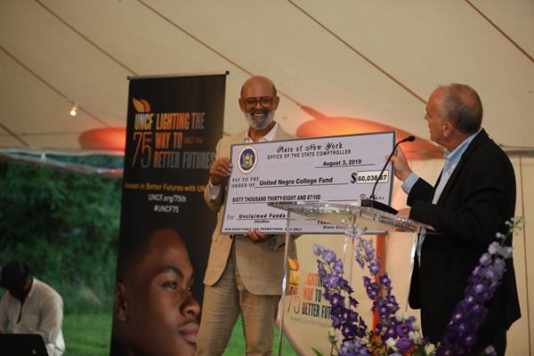 Michael L. Lomax, president and CEO, UNCF  with New York State Comptroller Thomas DiNapoli who made a check presentation for more than $60,000.
