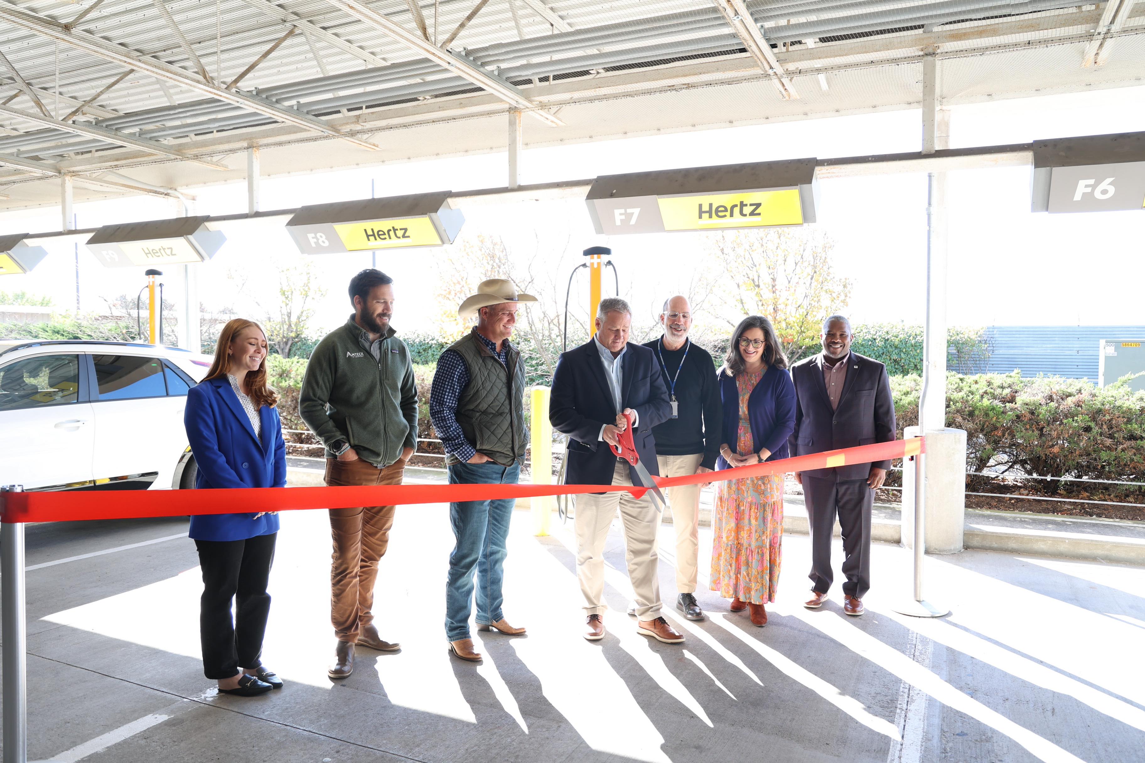 People Cutting Ribbon