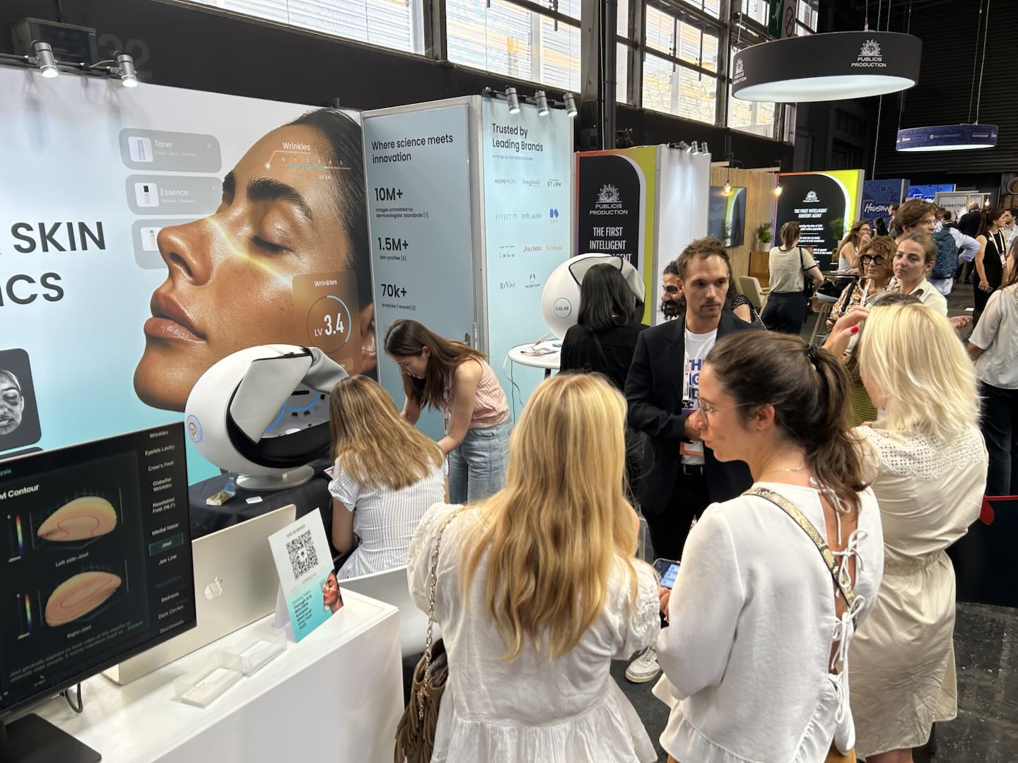 Visitors experience EveLab Insight's AI-powered skin analysis solution during a live demonstration at VivaTech 2025 in Paris. The booth drew interest from beauty professionals, tech media, and skincare brands.