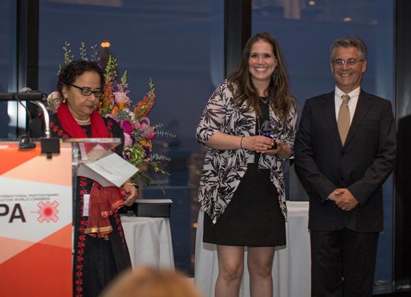 Cristina Romo (center) receiving the 2019 President’s Choice Award on behalf of from Sinuwave Technologies Corp. from IPA Past-President, Dr. Tayyaba Hassan (left), and IPA President, Dr. Luis Arnaut (right).