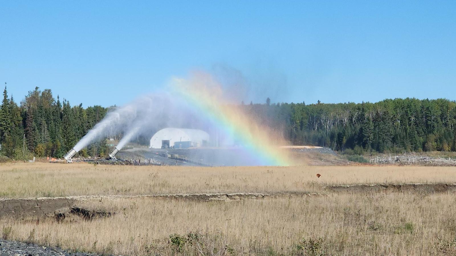 Figure 5: Two evaporator fans operating over the polishing pond at the Madsen Mine