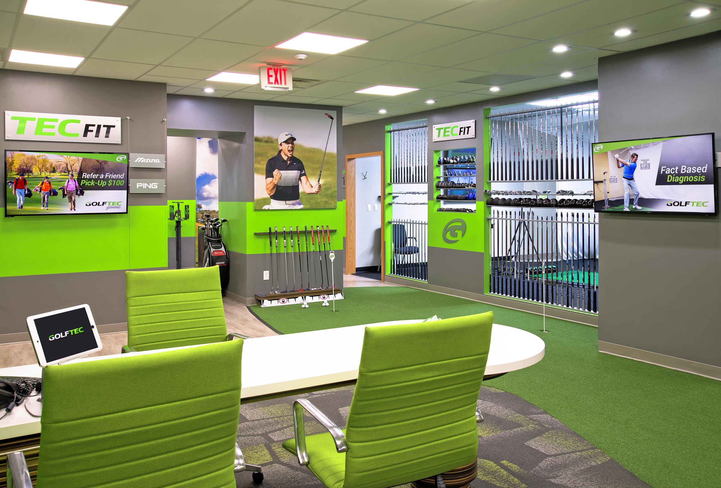 GOLFTEC lobby, putting green and club fitting wall