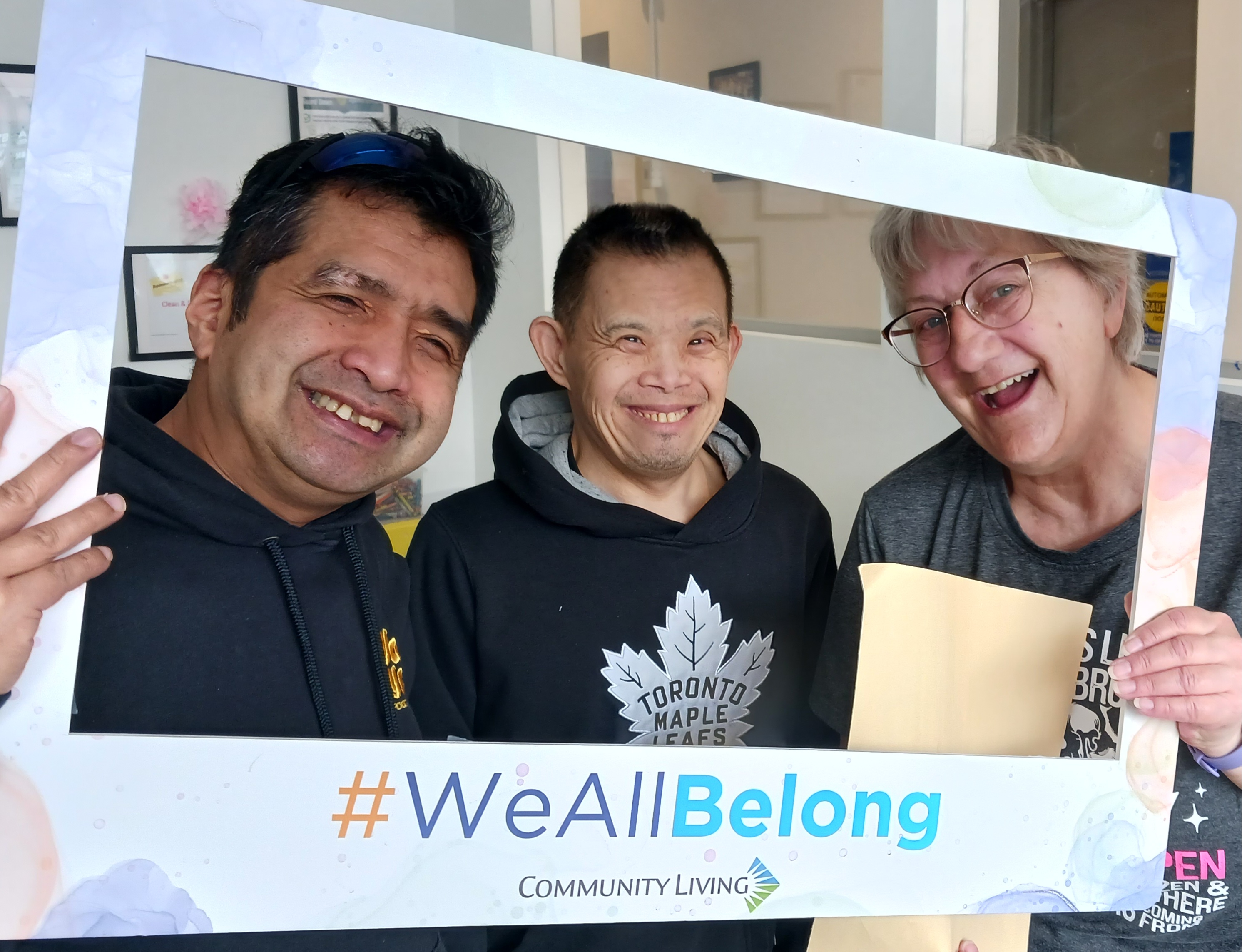 People supported by Community Living Toronto and their support worker come together to celebrate Community Living Month with the #WeAllBelong campaign.