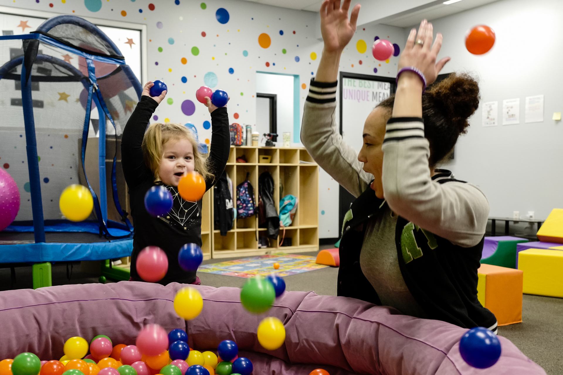 A therapist plays with a child at an InBloom Autism Services Learning Center.