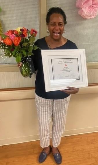 Cora Shaw receiving her award.