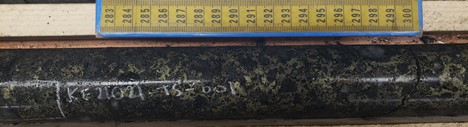 Plate 2: Net texture chalcopyrite-pyrite-pyrrhotite-sphalerite mineralization observed in hole KF21021 (26.3m)