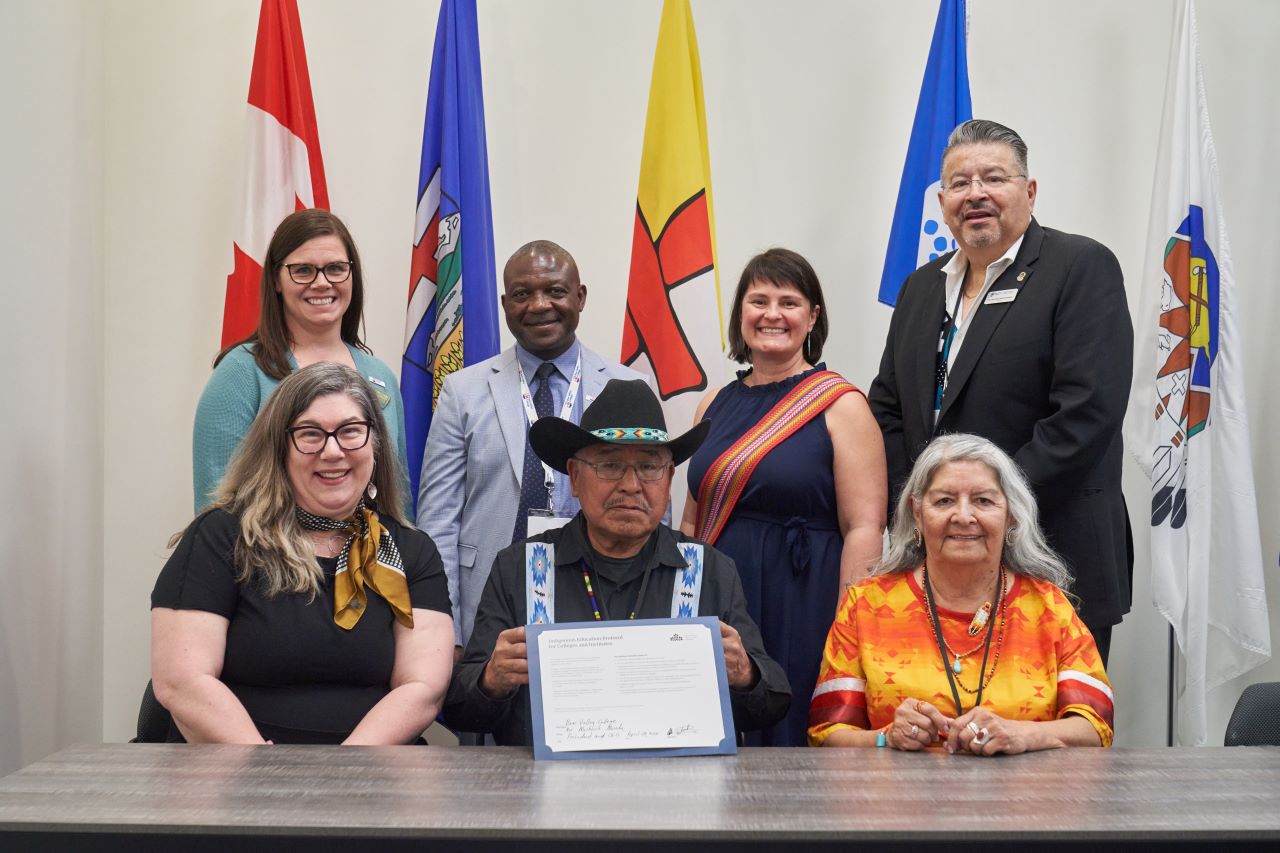 Back row: Lynn Connell, Vice President of Learner Experience, Dr. Misheck Mwaba, President and CEO, Jaime Fiddler, Learning Design Consultant, Curriculum Indigenization/Decolonization, and Dr. Maurice Manyfingers, Director of Indigenous Relations and Reconciliation at Bow Valley College. Front row: Pari Johnston, President and CEO, Colleges and Institutes Canada, Elder Clarence Wolfleg Sr., and Elder Christina Fox.