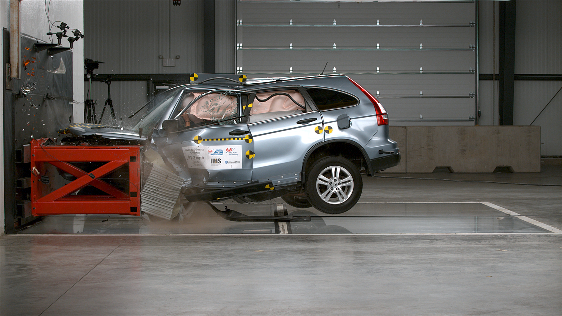 Action shot taken during the 56-mph moderate overlap frontal crash test. The vehicle's interior was significantly compromised in this test. 