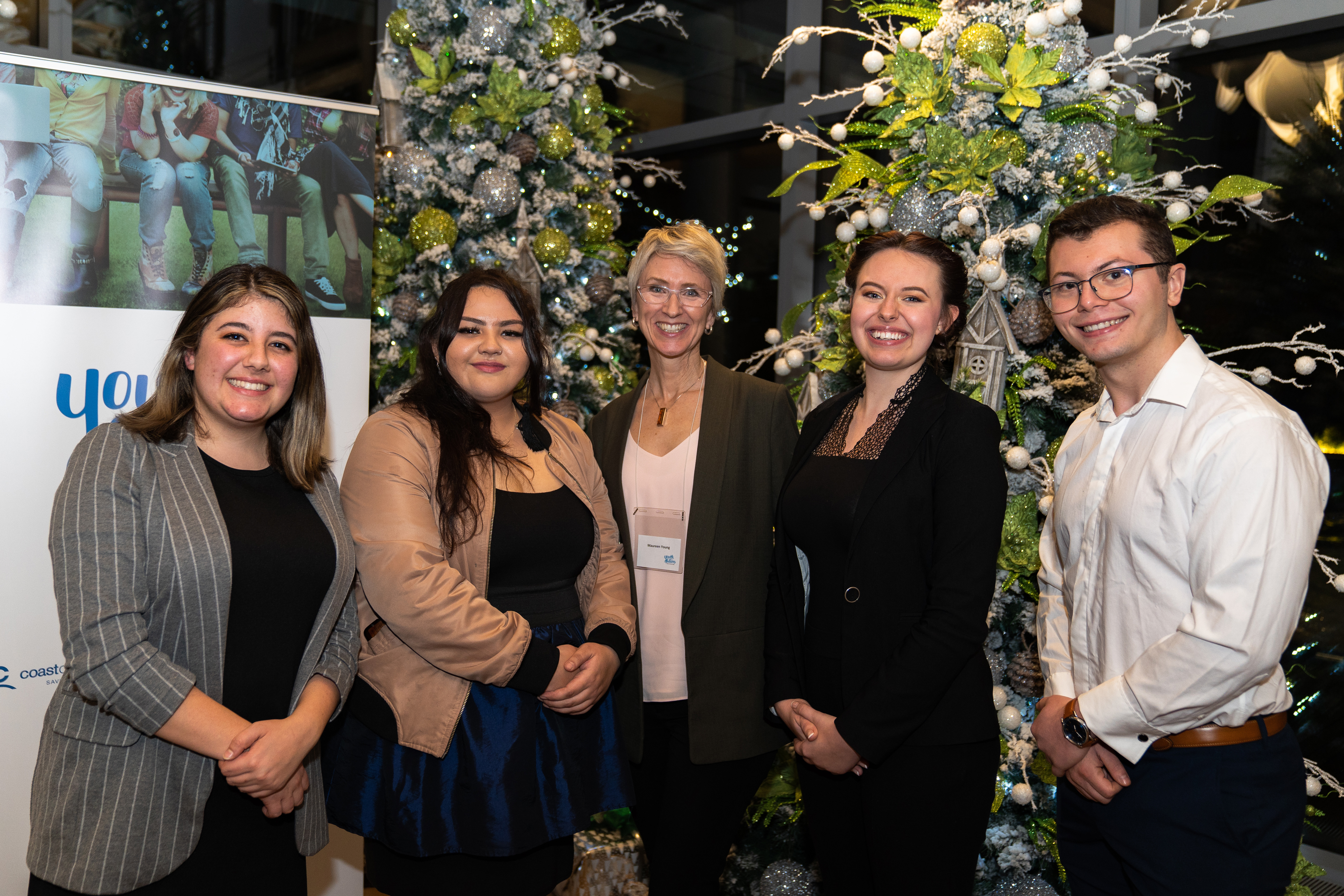 The unprecedented $600,00 figure was announced at an event December 10, 2019. From left to right: Soraya Bellou and Jodi Dekker (former youth in care, students); Maureen Young, Chair Youth Futures Education Fund and Director of Community Leadership, Coast Capital Savings); Mallory Woods and Nathaniel Andre-Peirano (former youth in care, students).