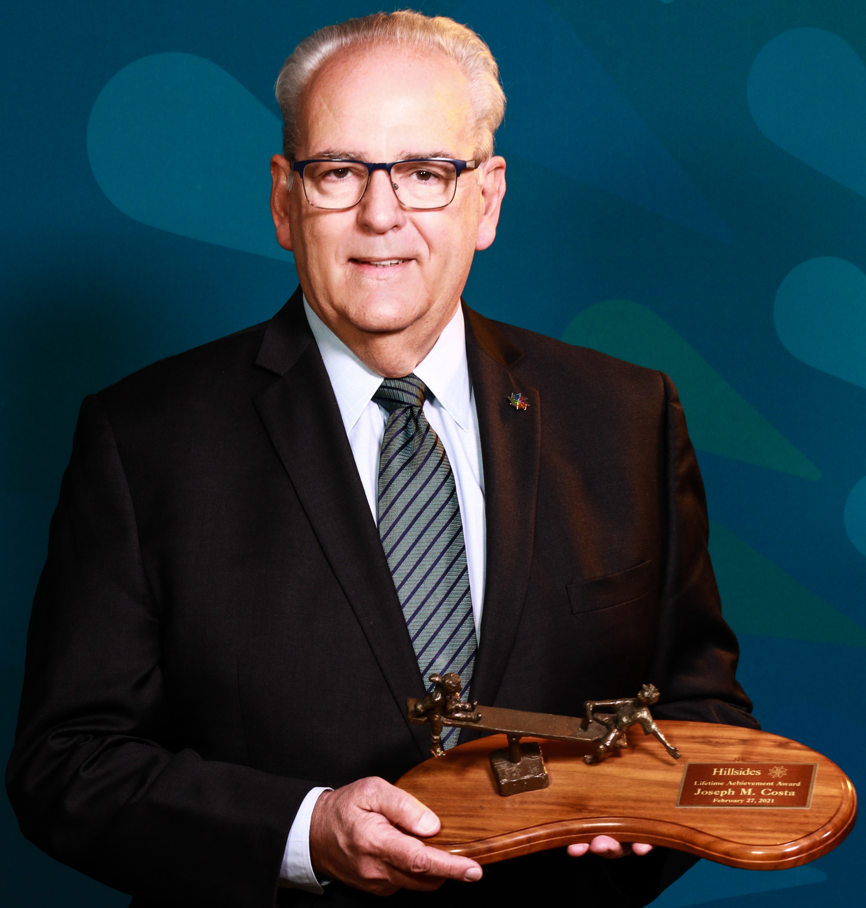 Hillsides Honorary Gala Chair and President and CEO Emeritus Joseph M. Costa with his Lifetime Achievement Award.