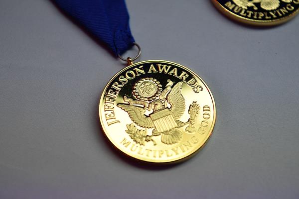 Multiplying Good's gold Jefferson Award Medallion