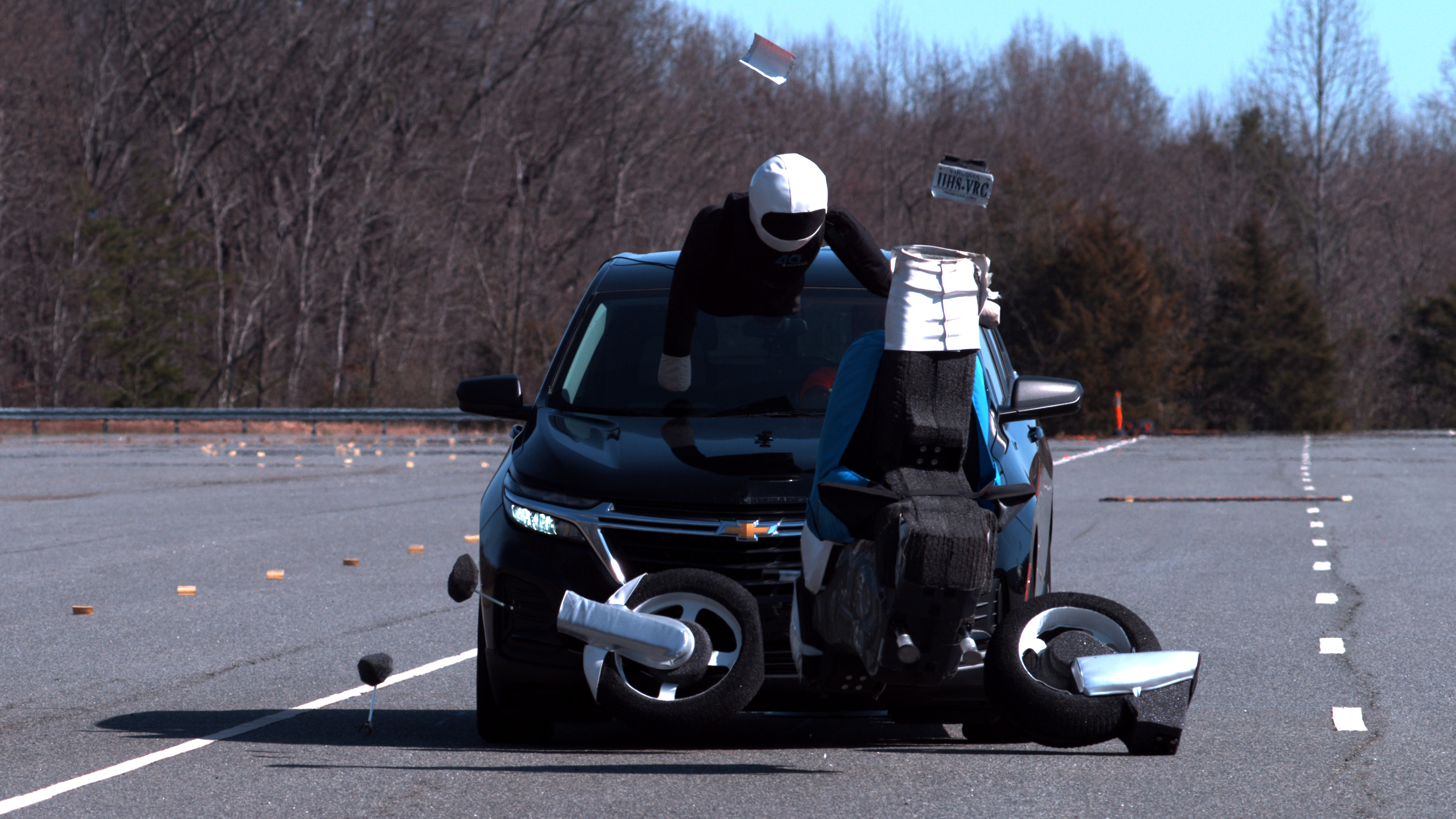 The 2023 Chevrolet Equinox strikes a motorcycle target during a 31-mph front crash prevention test at the IIHS vehicle research center in Ruckersville, Va. 