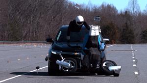 The 2023 Chevrolet Equinox strikes a motorcycle target during a 31-mph front crash prevention test at the IIHS vehicle research center in Ruckersville, Va. 