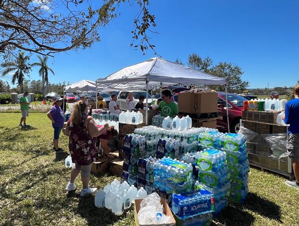 Volunteers hand out essential supplies to Ft. Myers residents