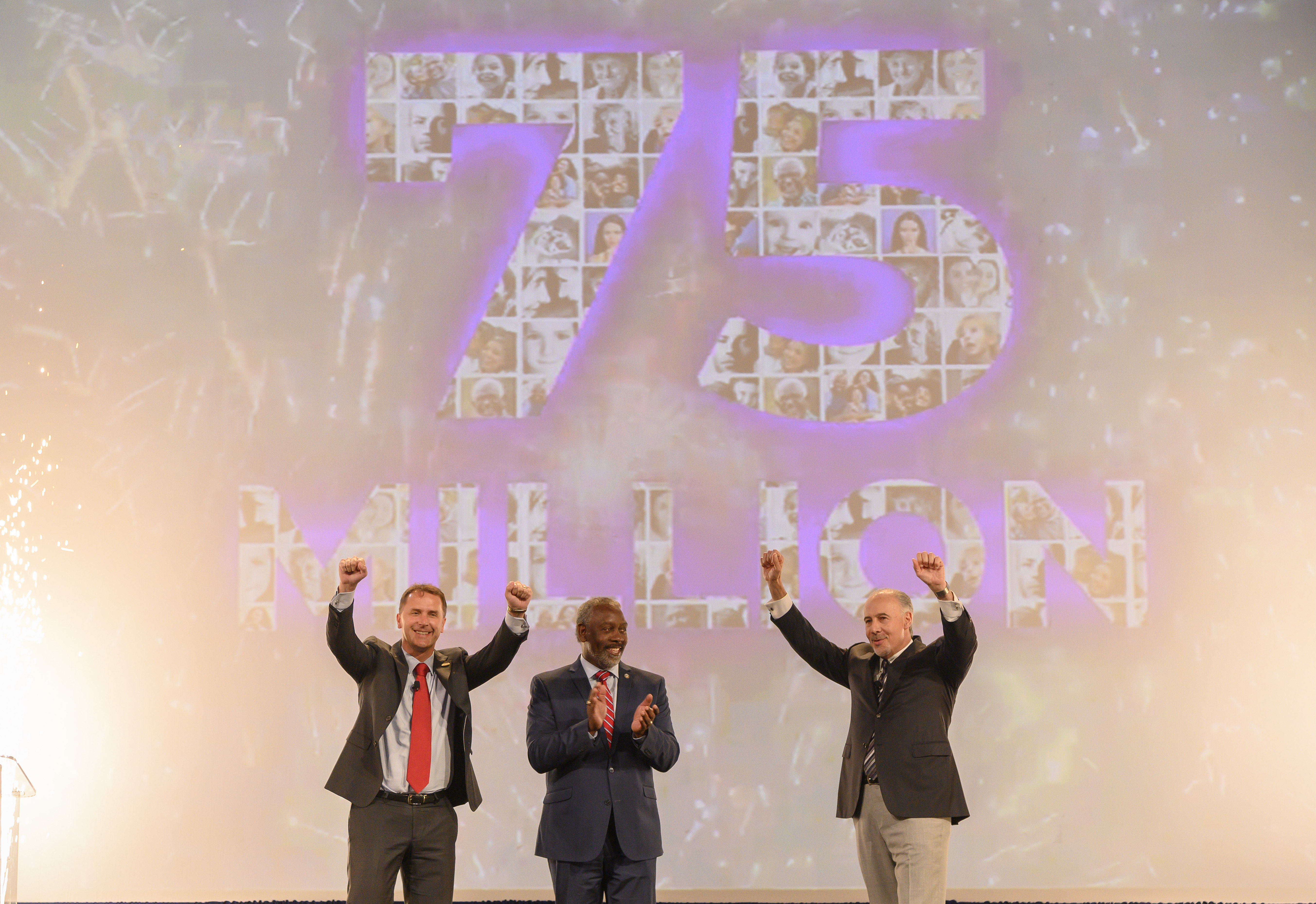 (Left to right) Adrian Jones, Visit Orlando Board Chair and Divisional Director USA, Merlin Entertainments USA Inc.; Orange County Mayor Jerry L. Demings; and George Aguel, President and CEO, Visit Orlando; celebrate a record 75 million visitors to Orlando in 2018.
