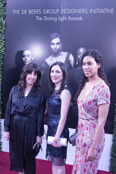 Canadian Shining Light Awards finalists, from left, Edna Milevsky (First Runner Up), Rana Mireskandari (Second Runner Up) and Cara Fitzell (First Place) pose for photos on the red carpet as they arrive for the awards gala held in Gaborone, Botswana. The De Beers Group Designers Initiative also presented awards to finalists from three other De Beers Group producer countries, South Africa, Namibia and Botswana.