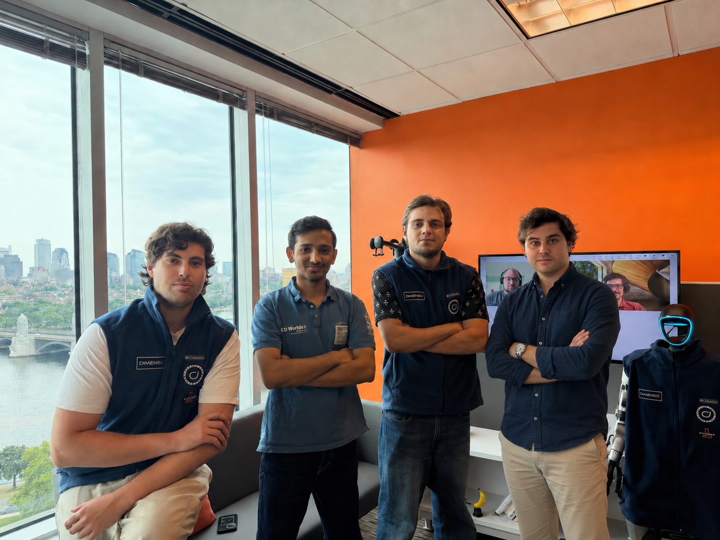 Four members of the Dimenso Technologies team standing together at the company's Cambridge, Massachusetts office