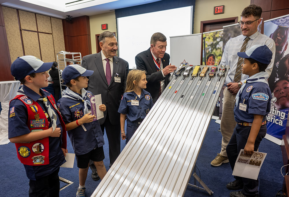 NASA astronaut and Distinguished Eagle Scout Award recipient Mike Fossum joins Scouts from the National Capitol Area Council in a Pinewood Derby race.