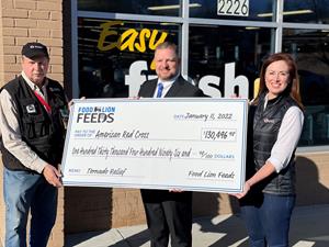 Food Lion Feeds presented the American Red Cross with a check for more than $130,000 earmarked for tornado disaster relief 