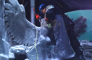Ice carver hard at work in ICE LAND at Moody Gardens
