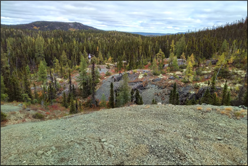 Outcropping serpentinized peridotite southern Seahorse Lake Intrusion (note helicopter in distance for scale)