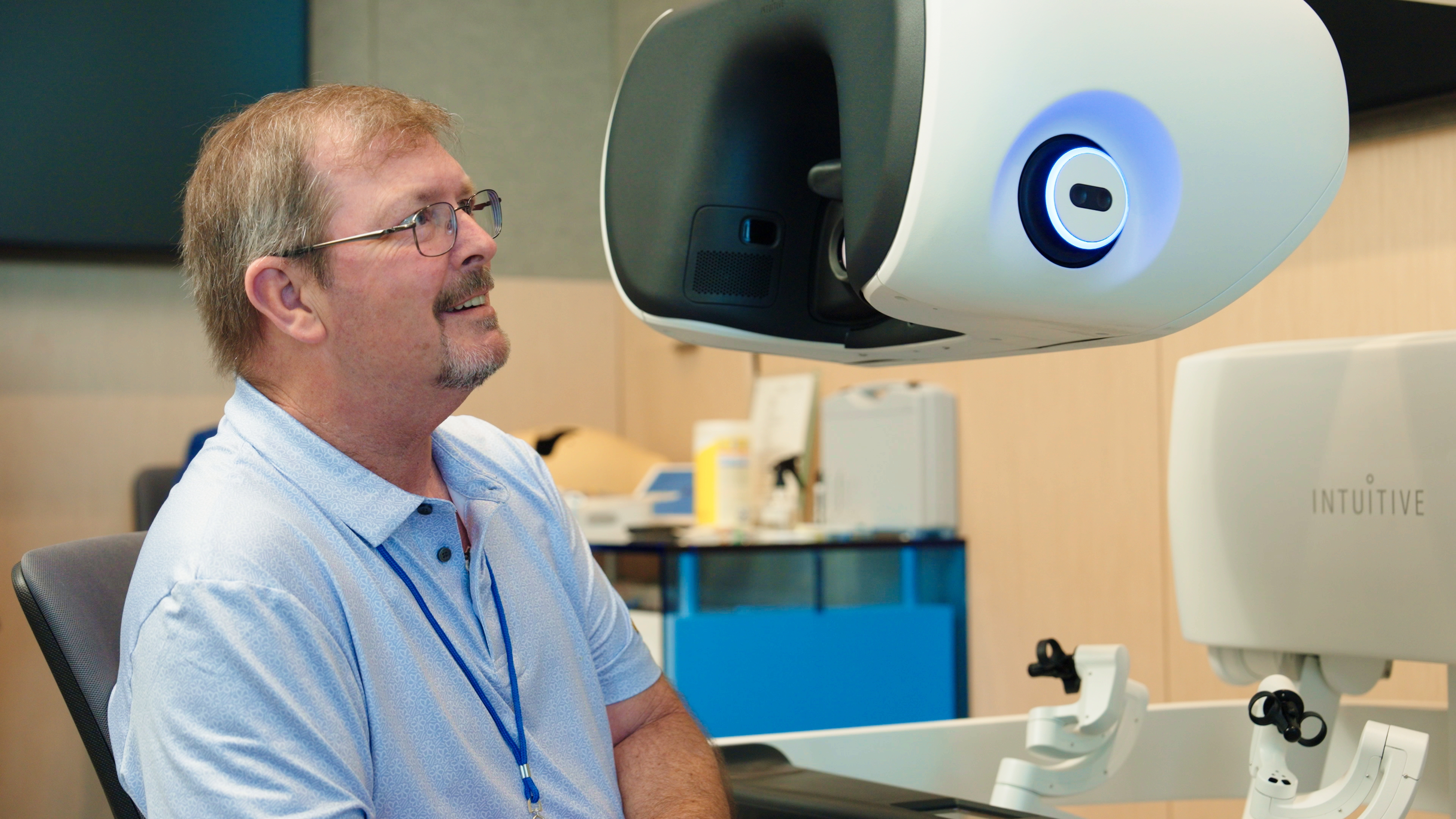 Dan Larson sits at the surgeon console of a da Vinci 5 robotic system at Intuitive facilities in Sunnyvale CA.