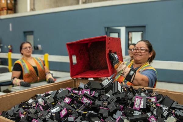 Workers sort ink cartridges at HP recycling center in La Vergne, TN