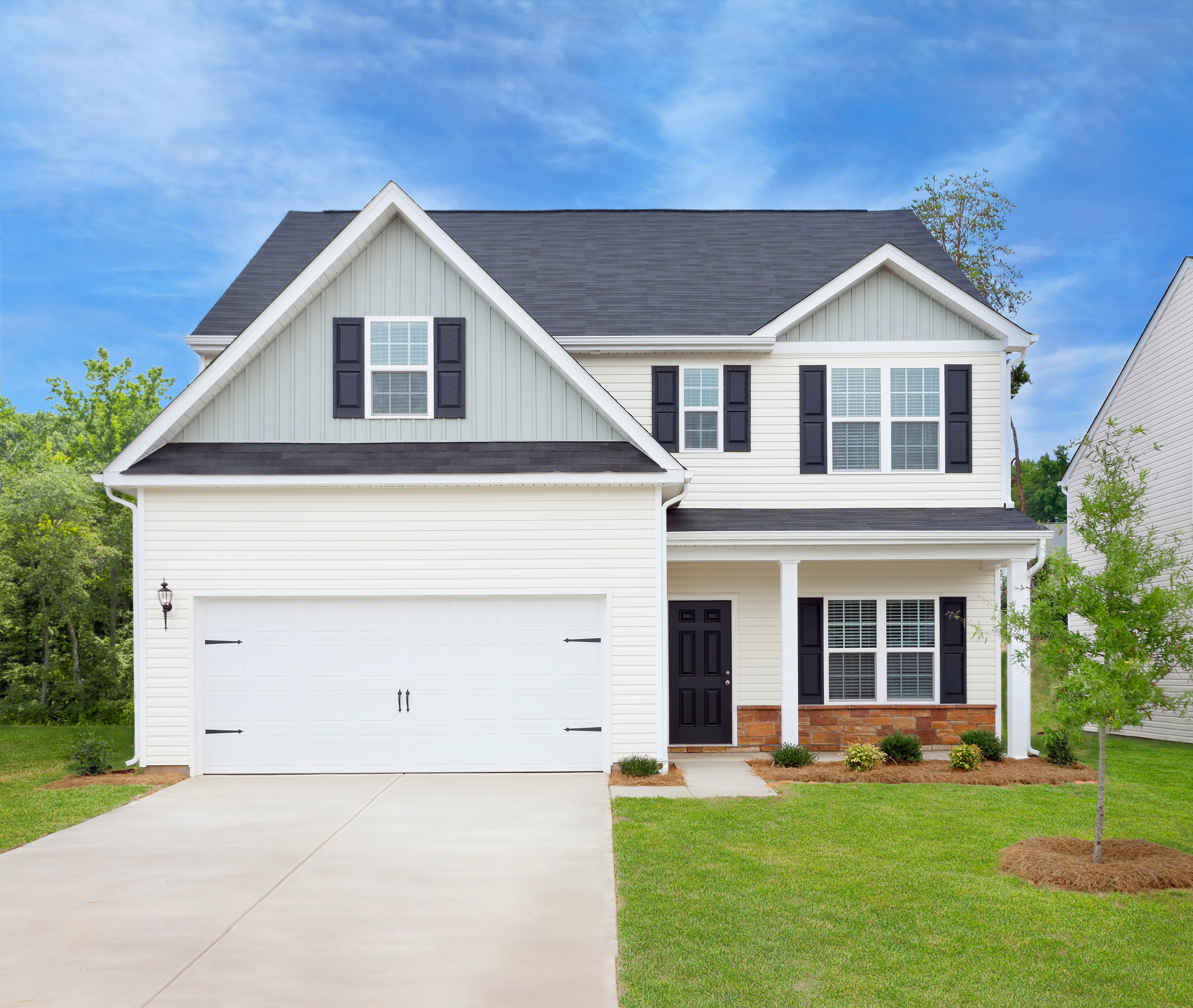 This four bedroom home showcases exterior stone accents, two living spaces and walk-in closets throughout.