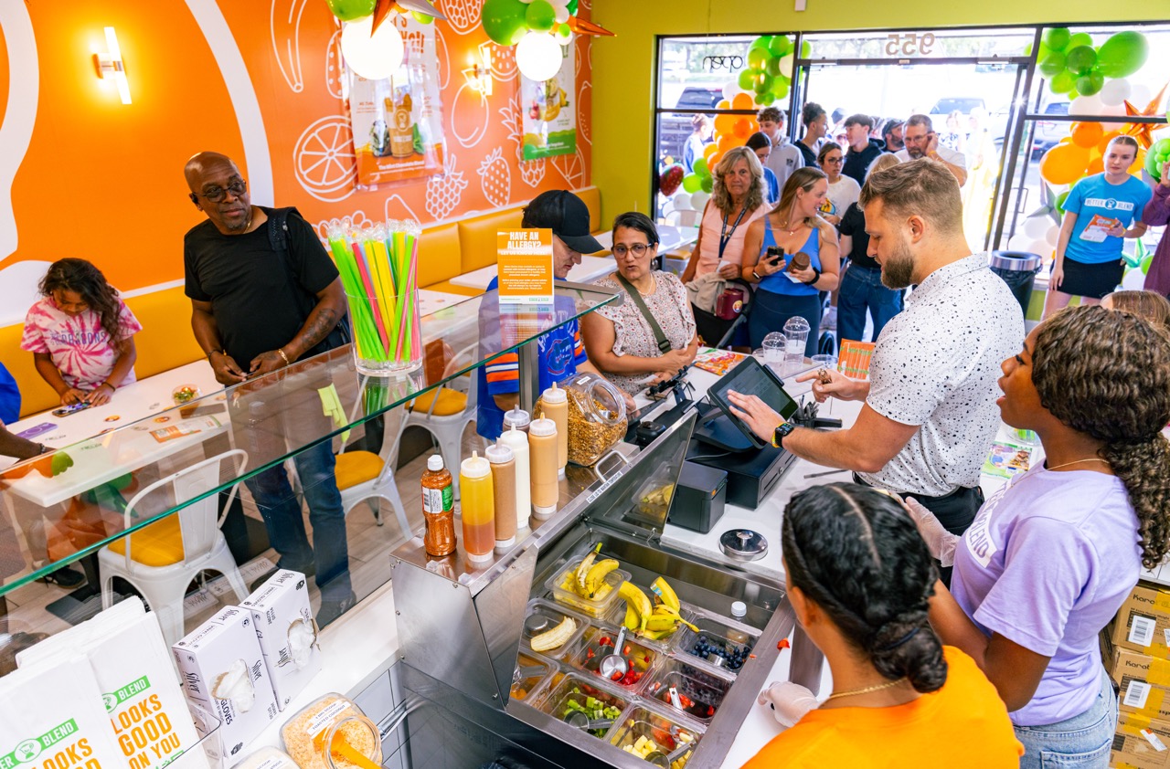 Customers visit a Better Blend restaurant serving fresh smoothies and açaí bowls.