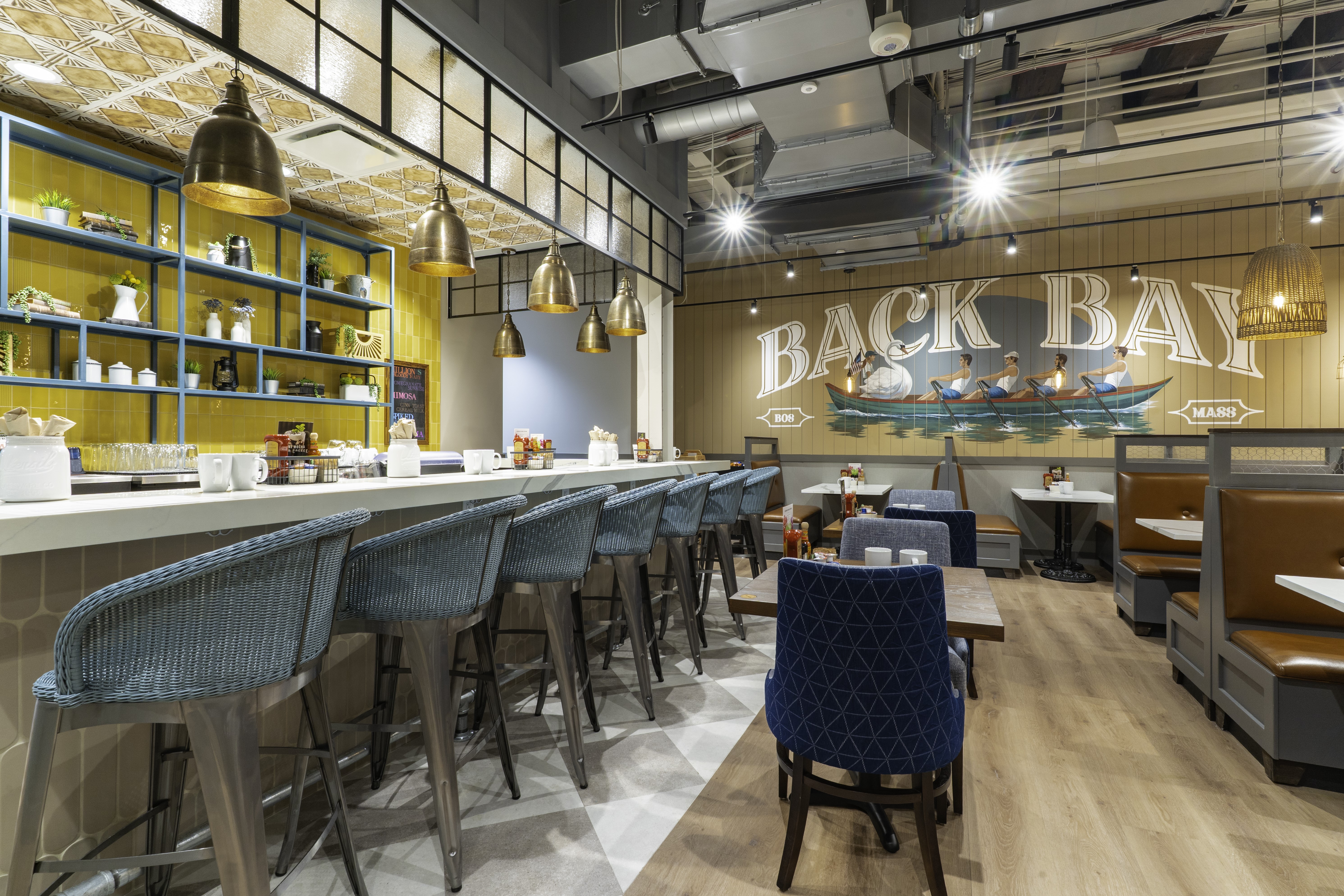 The downtown Boston restaurant features a Back Bay-inspired mural created exclusively for the Boylston Street location