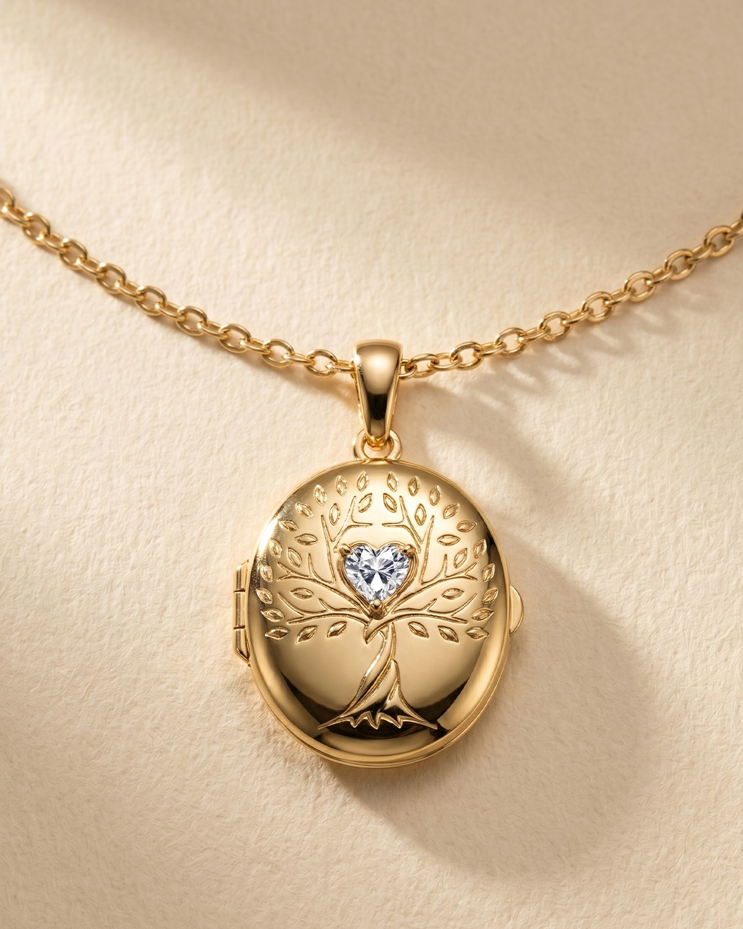 Gold-plated TOTWOO Smart Locket features a Tree of Life design.