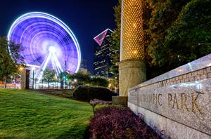 image shows the Skyview Atlanta Observation wheel in downtown Atlanta in the night skyline