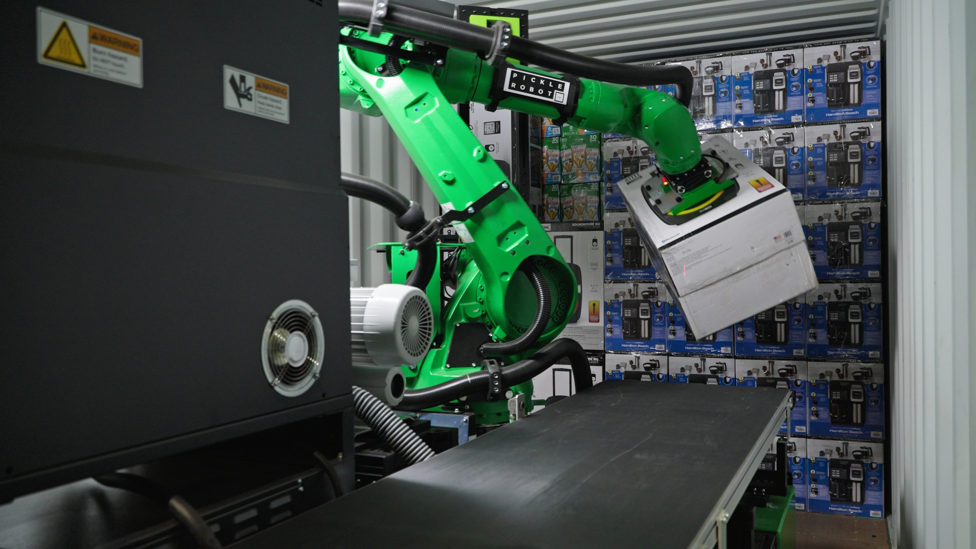 Pickle Robot Unloading a Container of Consumer Electronics