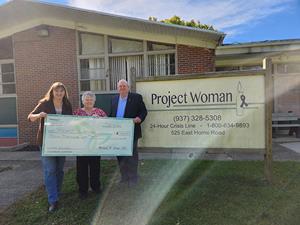 Pathways supports Project Woman with $3,000 donation during Domestic Violence Awareness Month