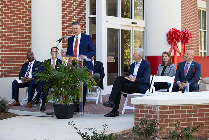 Jim Richards speaks at ribbon cutting for Roy Richards Sr. Hall